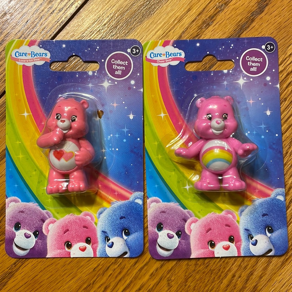 Care bear figurines. (In package)
